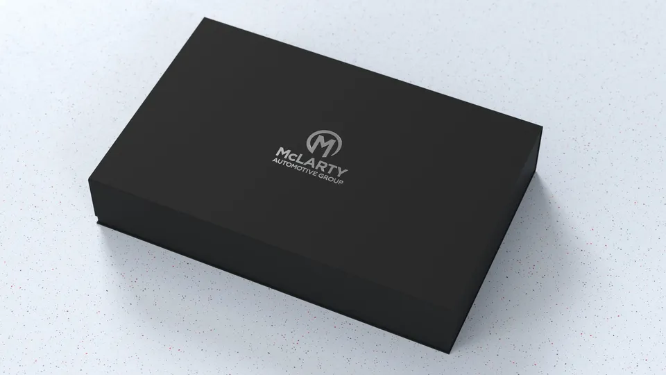 Matte black McLarty gift box with foil-stamped logo