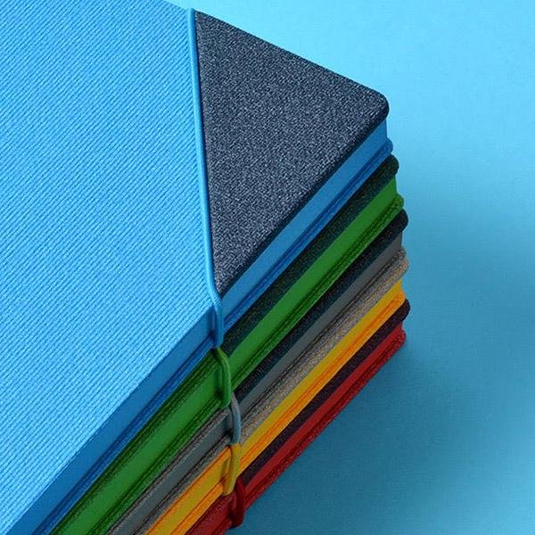 Stack of corporate diaries in contrasting cover colours